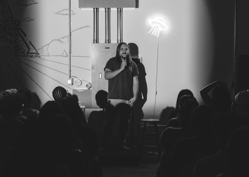 Comedian performing at Spaced Out Comedy